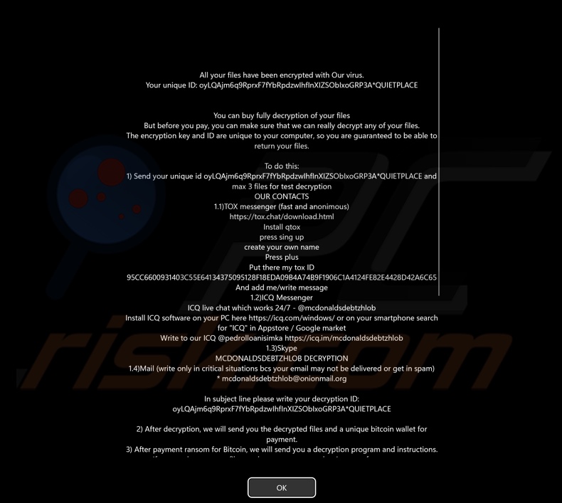 Schermata della nota di riscatto di Mimic ransomware visualizzata prima della schermata di accesso